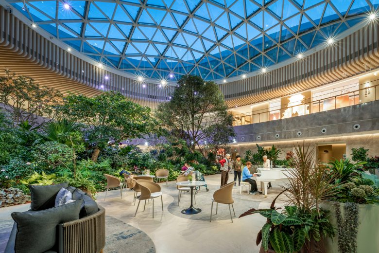 зал с цветами столики и стулья Activity Center of Taikang Community Yan Garden